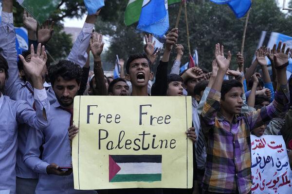 Supporters of a students group 'Muslim Talba Mahaz Pakistan' chant slogans against the against Israeli airstrikes on Gaza during a rally to show solidarity with Palestinian people, in Lahore, Pakistan. Picture: AP Photo/K.M. Chaudary