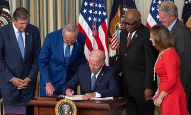 President Joe Biden signs HR 5376, the Inflation Reduction Act of 2022 in the state dining room of the White House
