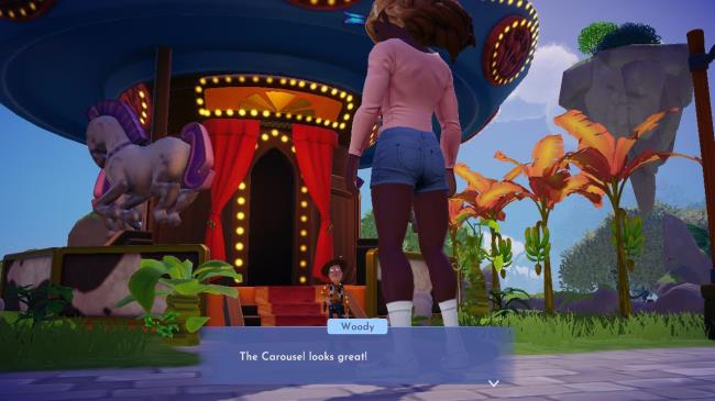 Player character speaking to Woody outside his Carousel with the lights on in Disney Dreamlight Valley. 
