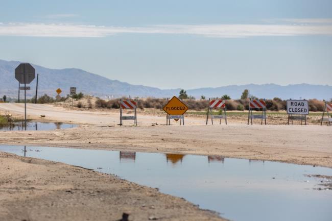 A closed off road due to flooding from Hurricane Hilary in the Coachella Valley on Aug. 23, 2023.