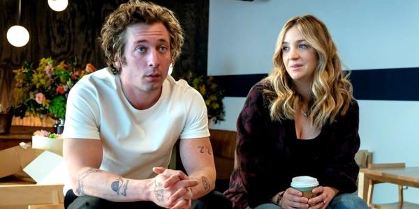 Jeremy Allen White's Carmen looking at the front while his sister is smiling in The Bear season 3