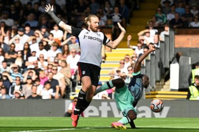 Fulham’s Tim Ream fouls Brentford’s Yoane Wissa in the penalty area