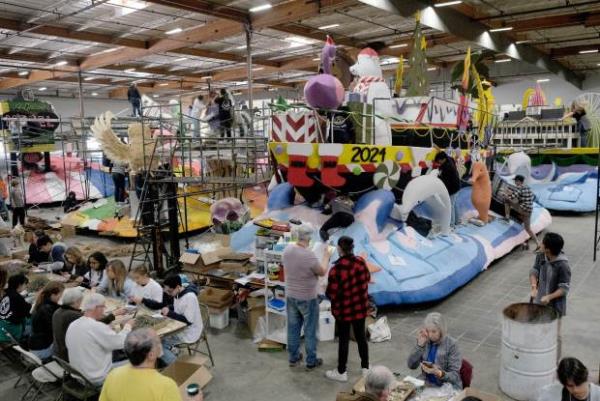 Volunteers decorate the Newport Beach float “Jingle on the Waves,”...
