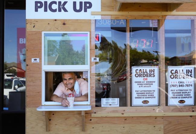 Fru-ta artisan ice cream shop owner Salvador Cruz built a takeout window for customers to order and pickup from without entering his store in Santa Rosa. (Christopher Chung / The Press Democrat file)