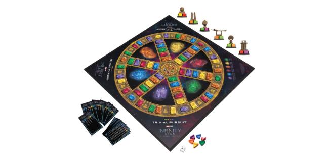  Trivial Pursuit Marvel Cinematic Universe Ultimate Edition board with pieces, dice, and question cards.